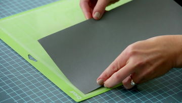 Loading cardstock on to a cutting mat