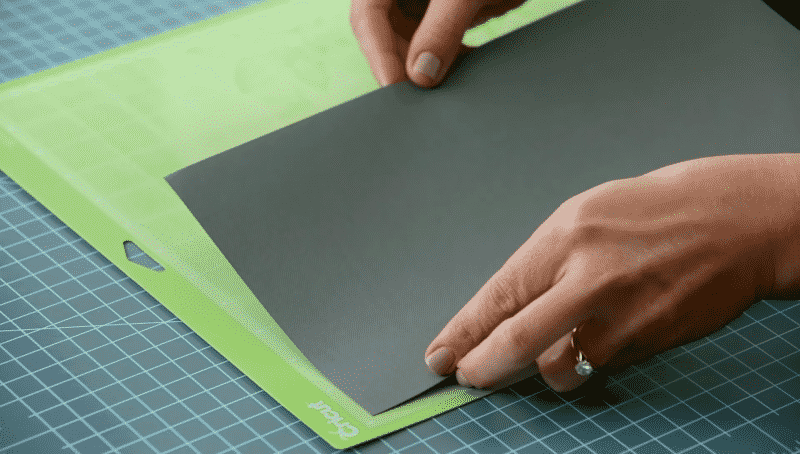 Loading cardstock on to a cutting mat