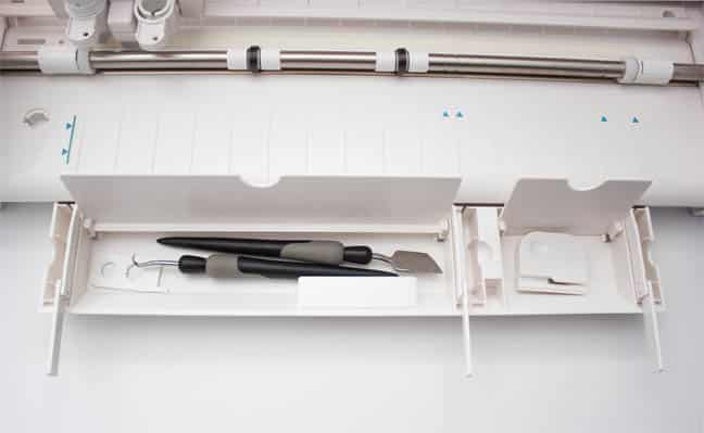 bottom storage compartment on Silhouette Cameo 3, with flip out arms to support the cutting mat