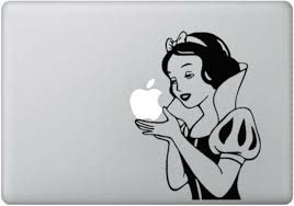 A Snow White decal holds the apple on the back of an Apple laptop