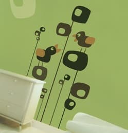 Vinyl bird decals on a green wall.