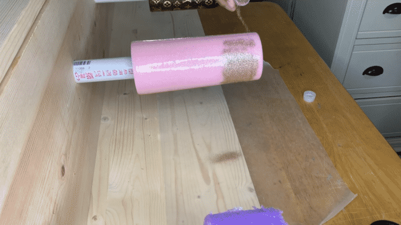 Applying additional glitter to the tumbler