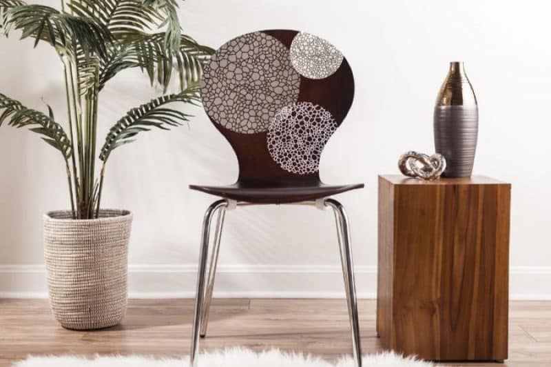 A wood chair decorated with vinyl