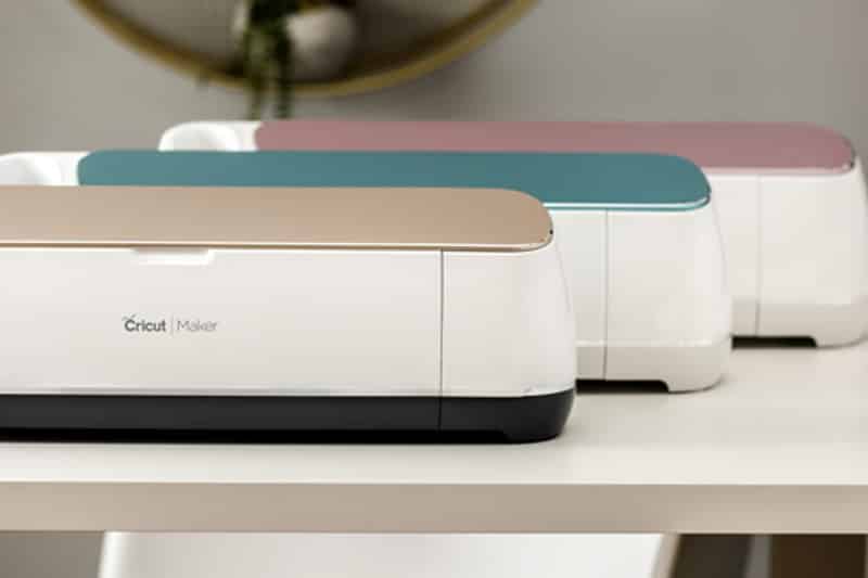 The Cricut Maker is shown in three different colors: champagne, rose, and blue.