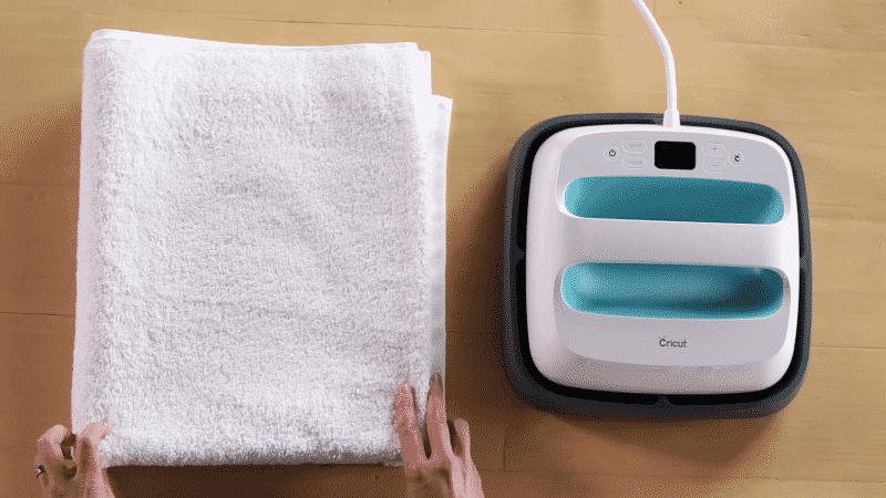 You can use a folded towel as your pressing surface with an EasyPress or household iron.