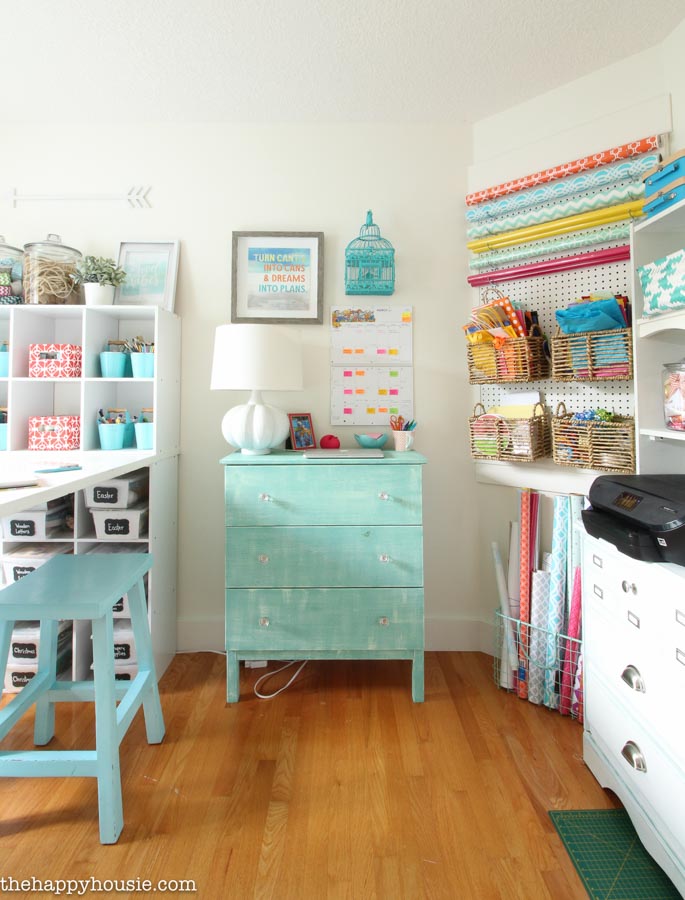 Well-organized crafts in cubbies and pegboard