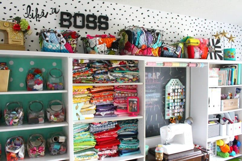 Colorful sewing wall filled with fabrics