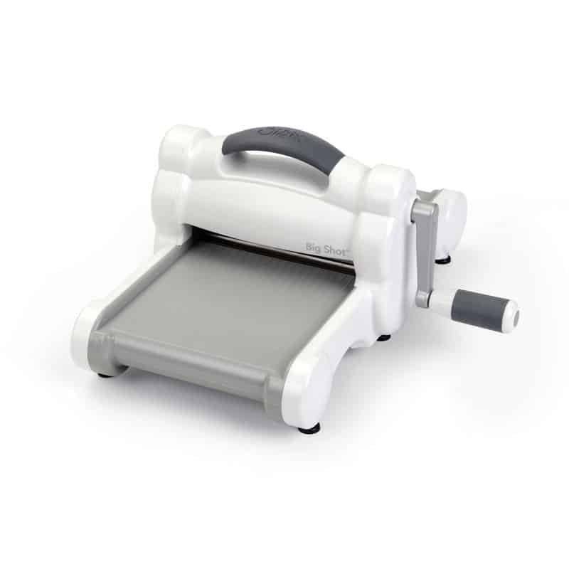 The Sizzix Big Shot has a gray cutting bed and a manual crank.