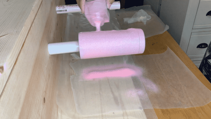 Pouring glitter on the epoxy tumbler